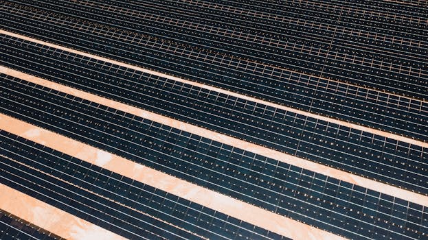 Aerial shot showcasing rows of solar panels harnessing alternative energy efficiently.