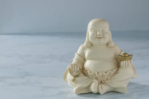 Close-up of a Laughing Buddha Figurine