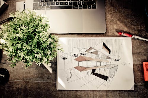 Free Brown House Illustration on Brown Wooden Table Stock Photo