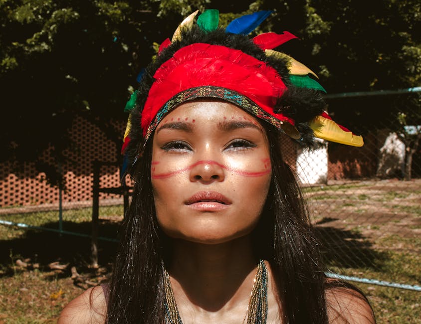 Woman Wearing Red and Black Feather Hat