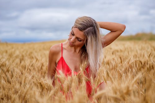 A Woman in a Spaghetti Strap on a Wheat Field