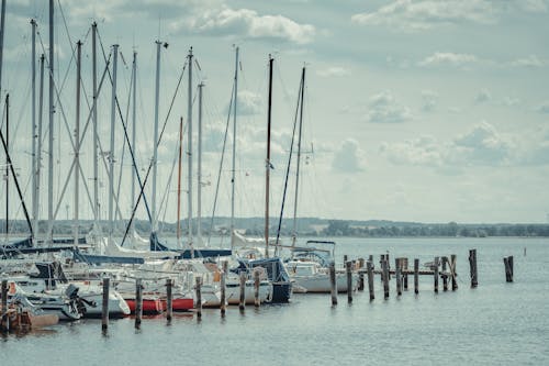 Free White Boats Docked on the Side of the Sea Stock Photo