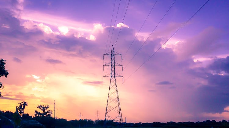 Photography Of Electric Tower During Sunset