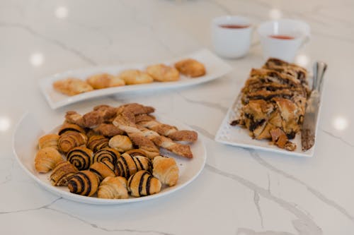 Tasty Breads on White Ceramic Plates