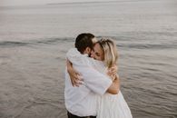 A Couple Hugging by the Seaside