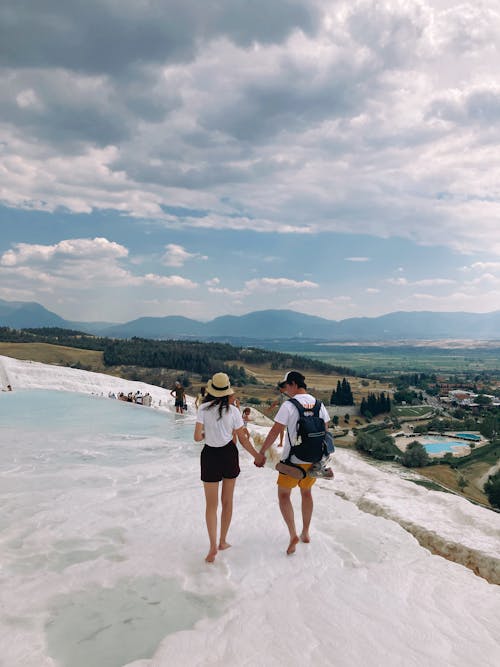 Back View of Couple Doing Holding Hands 