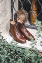 Brown Leather Boots on Green and White Floral Textile