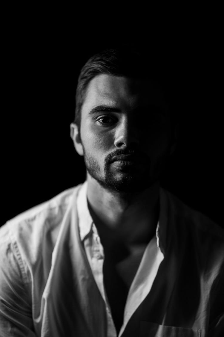 Grayscale Photo Of Man In White Button Up Shirt