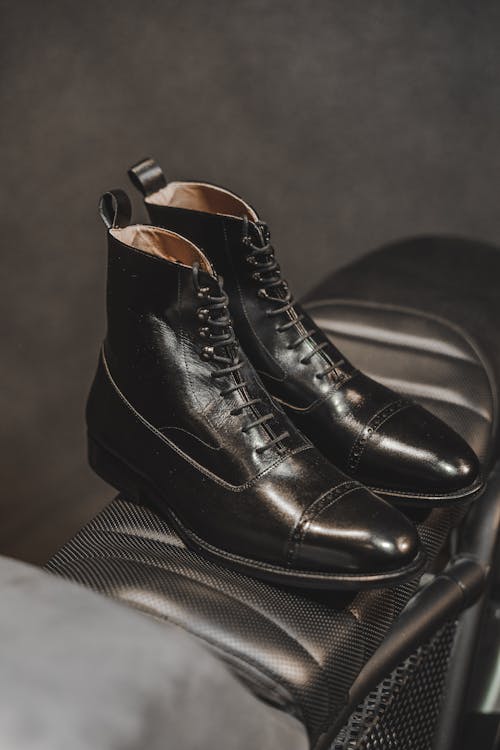 Free Selective Focus Photo of Black Leather Boots Stock Photo