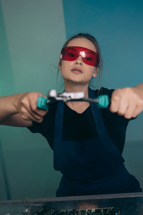 Beautiful Woman Holding a Tool