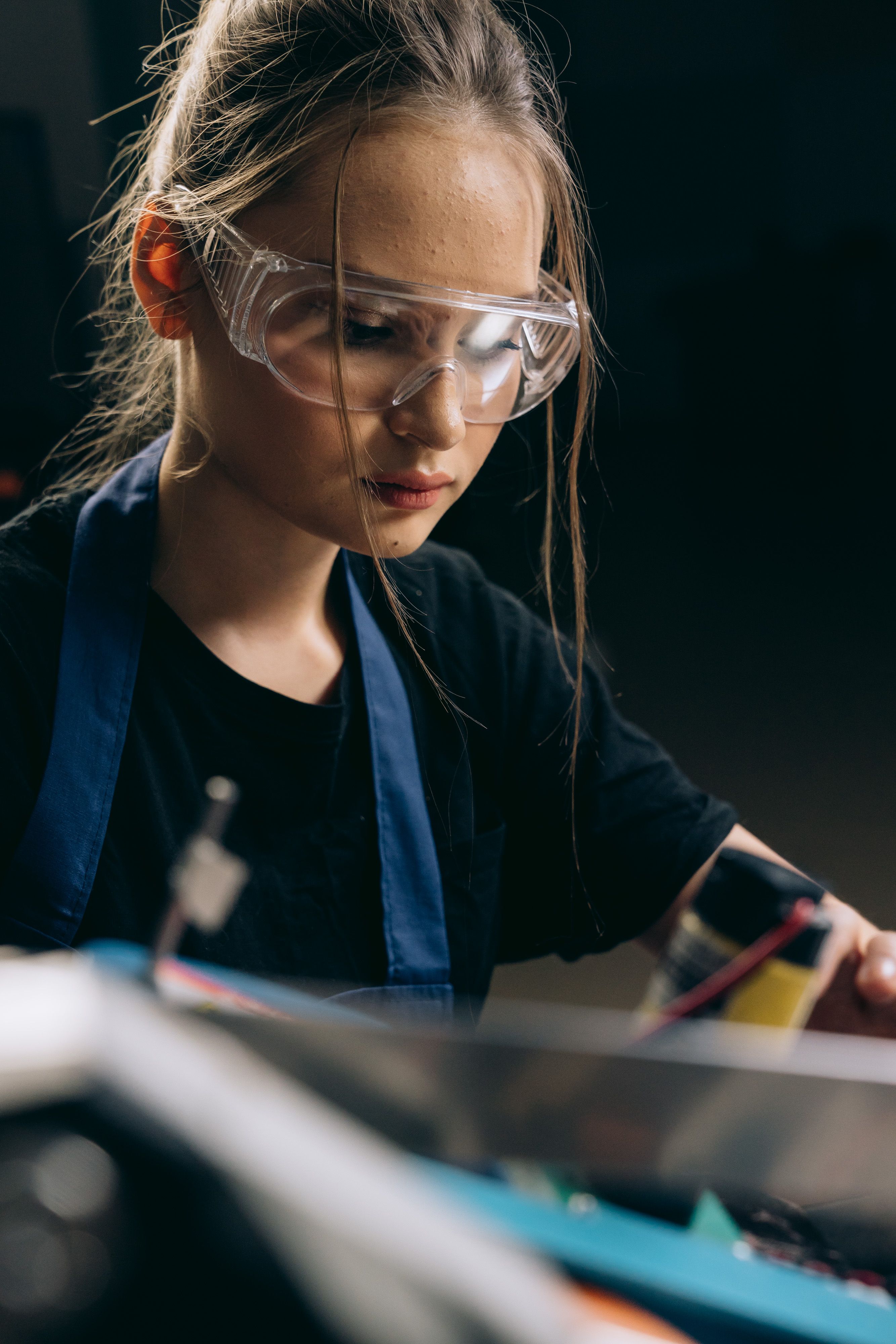 Person wearing safety glasses over prescription eyewear