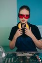 A Portrait of a Young Woman Wearing Safety Glasses