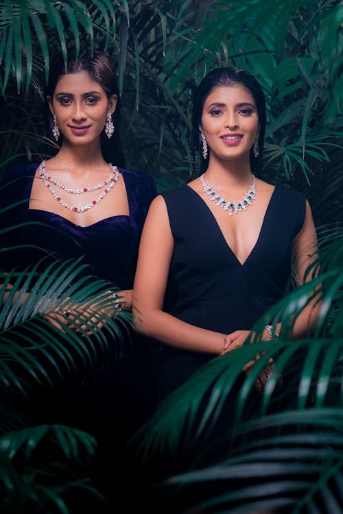 Portrait of Two Women Wearing Black Dresses