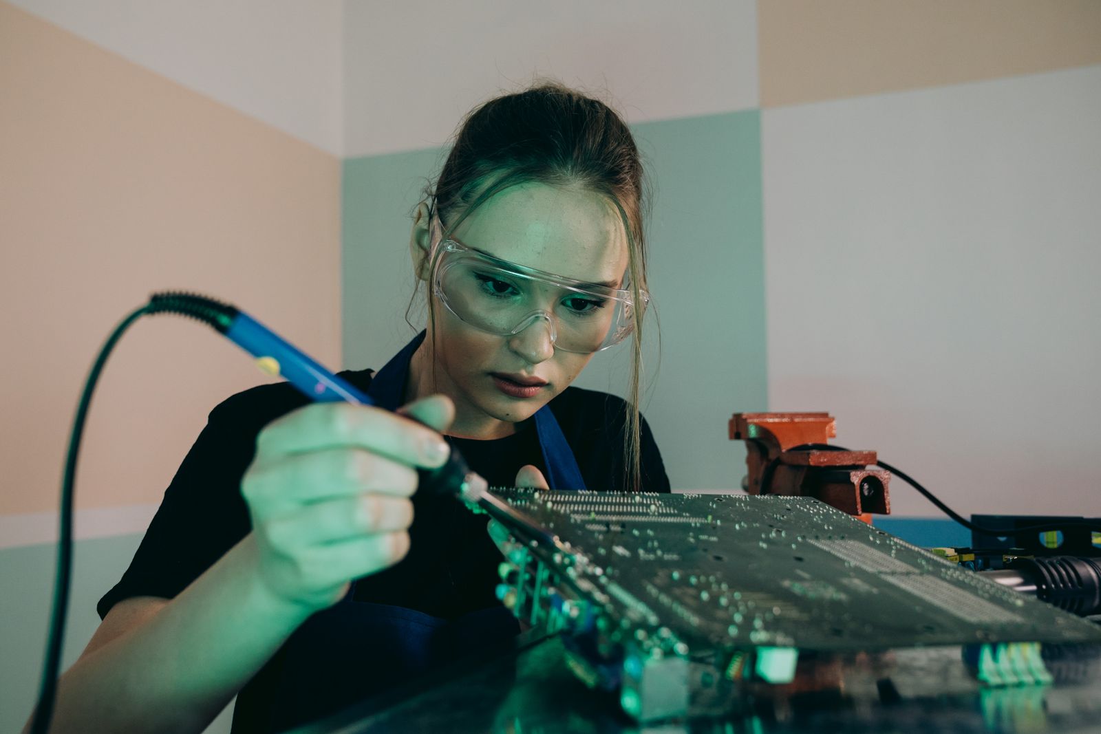 Work on a circuit board assembly. Illustrative photograph.