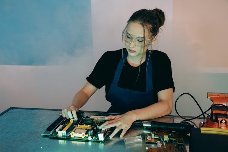 Woman Working On Computer Hardware