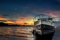 White Boat on Body of Water during Golden Hour