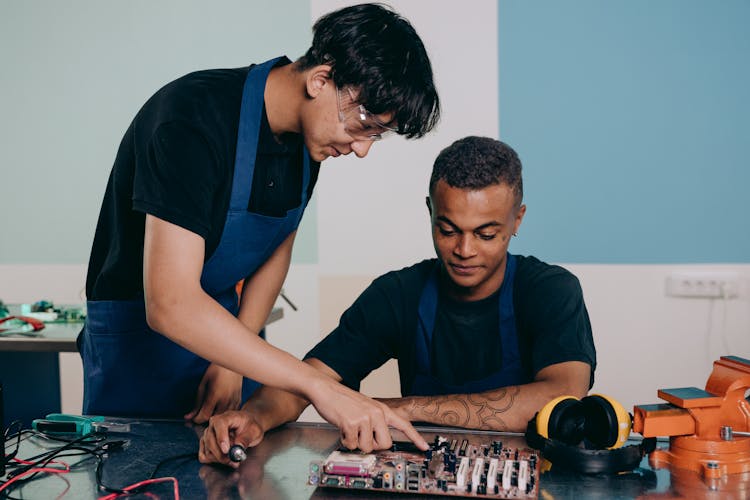 Men Working On Computer Hardware