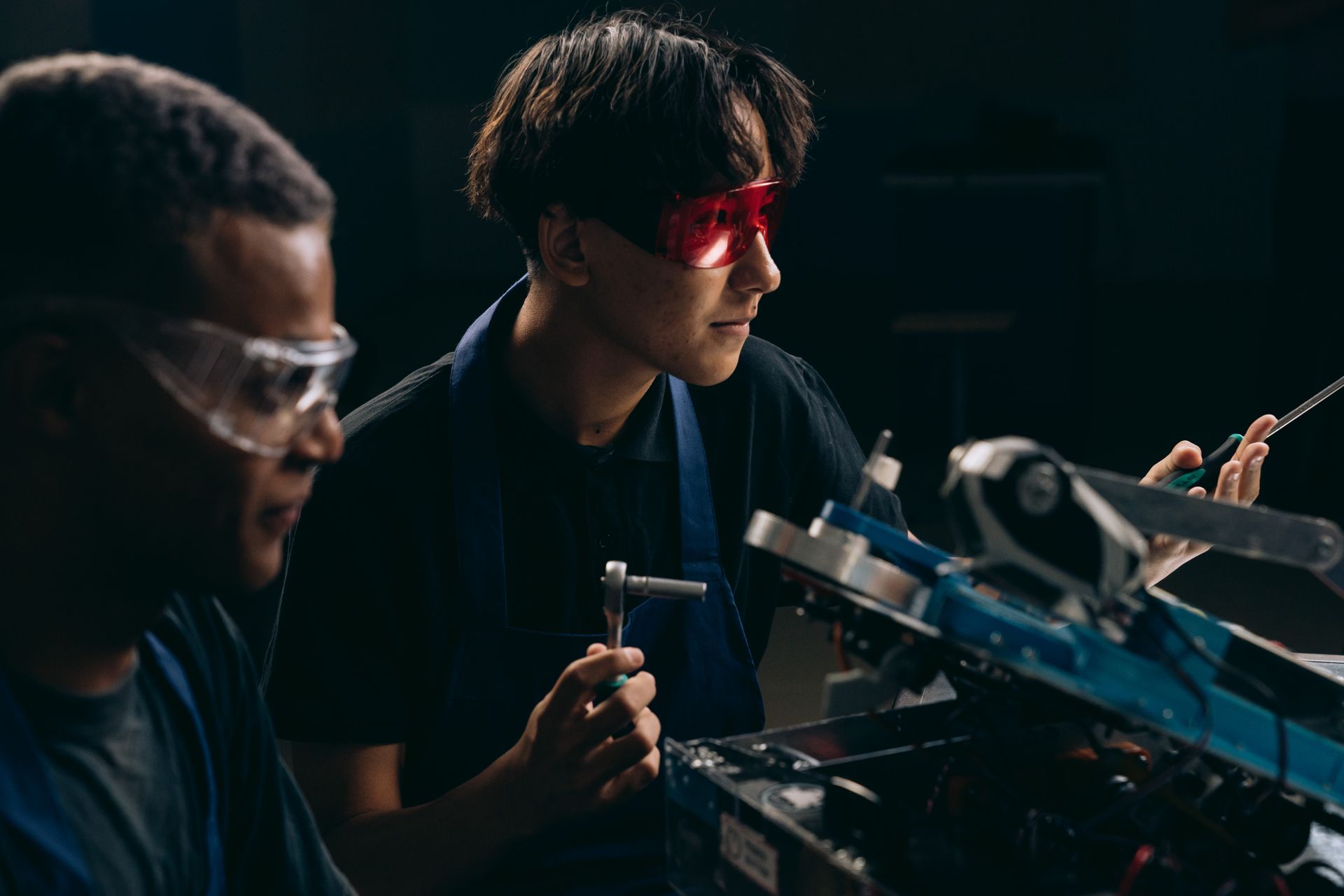 Men Fixing a Machine