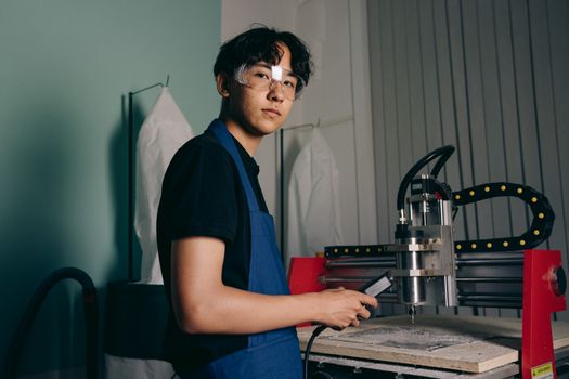 A Man Using a Machine