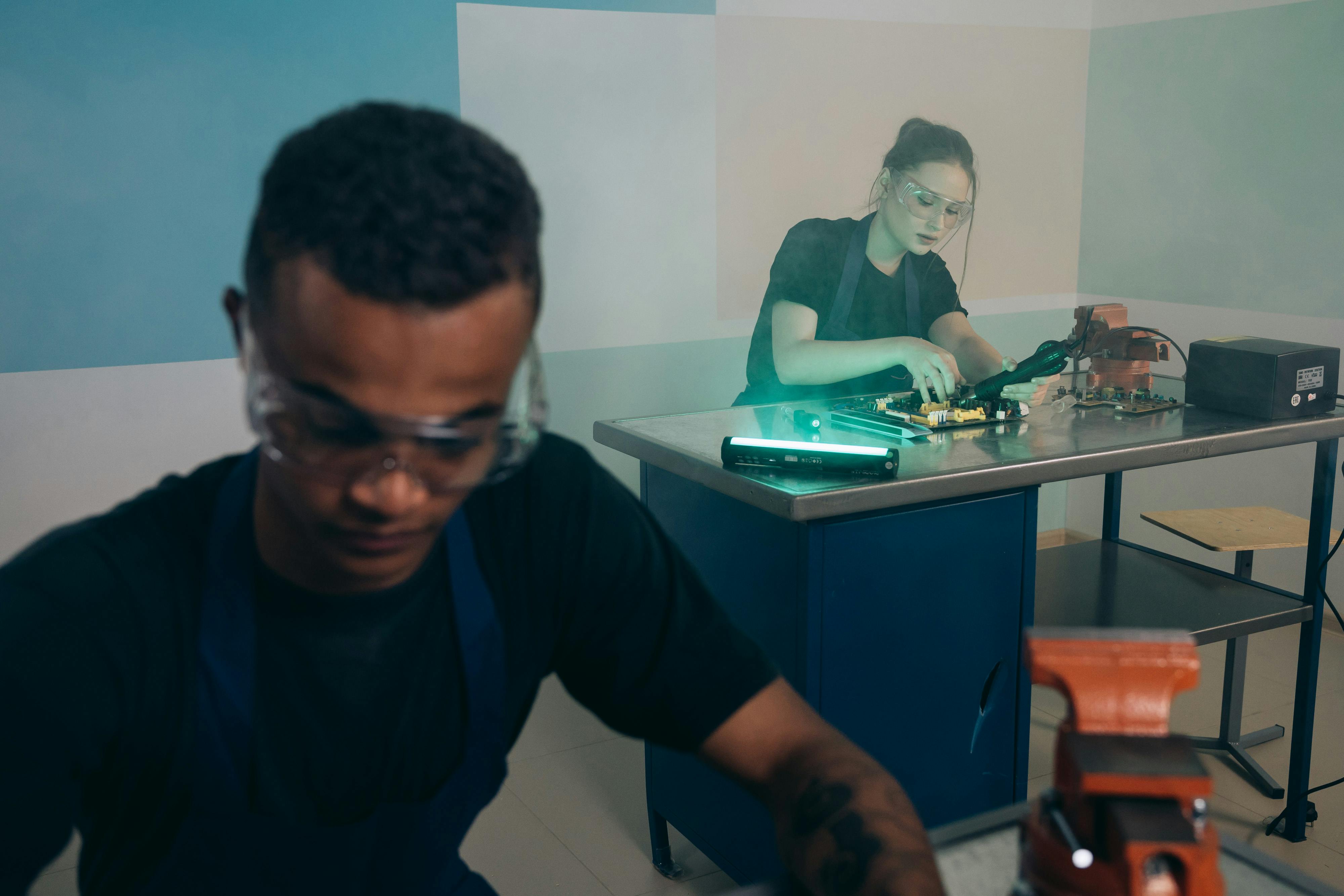 AV technicians collaborating on wiring setup - audio visual contractors near me