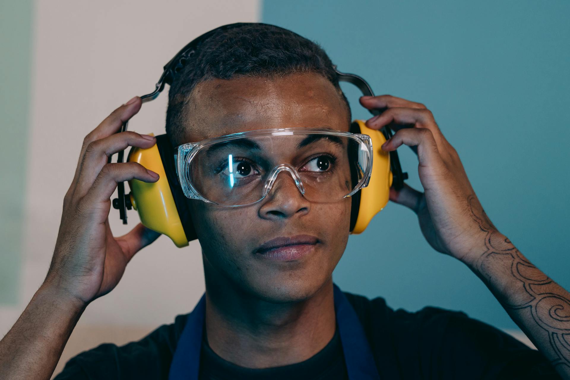 A Man Wearing Ear Muffs