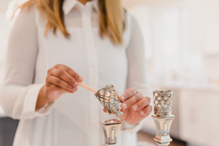 Woman Lighting Candles 