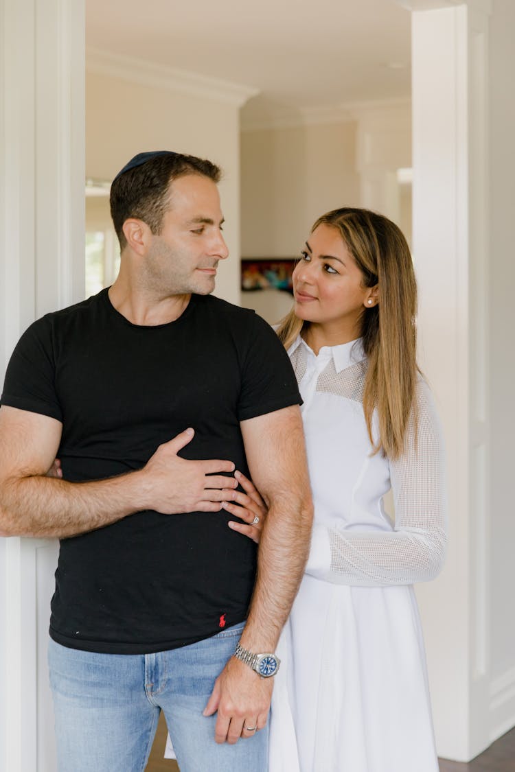 Couple At Home Looking At Each Other 