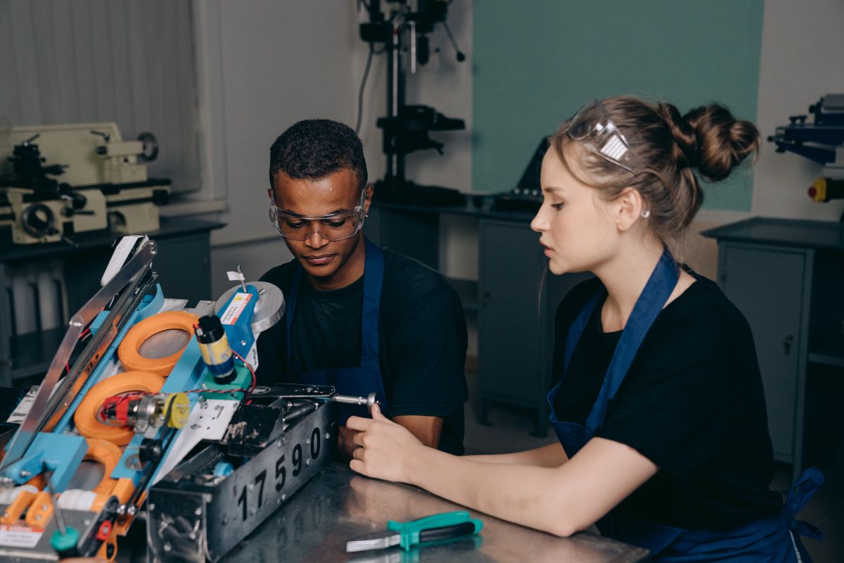 Person in vocational training working with tools and equipment