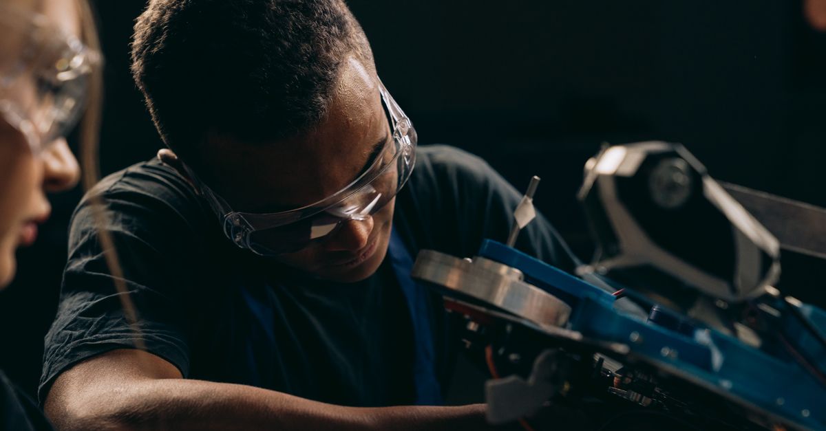 A Man Working with a Machine · Free Stock Photo