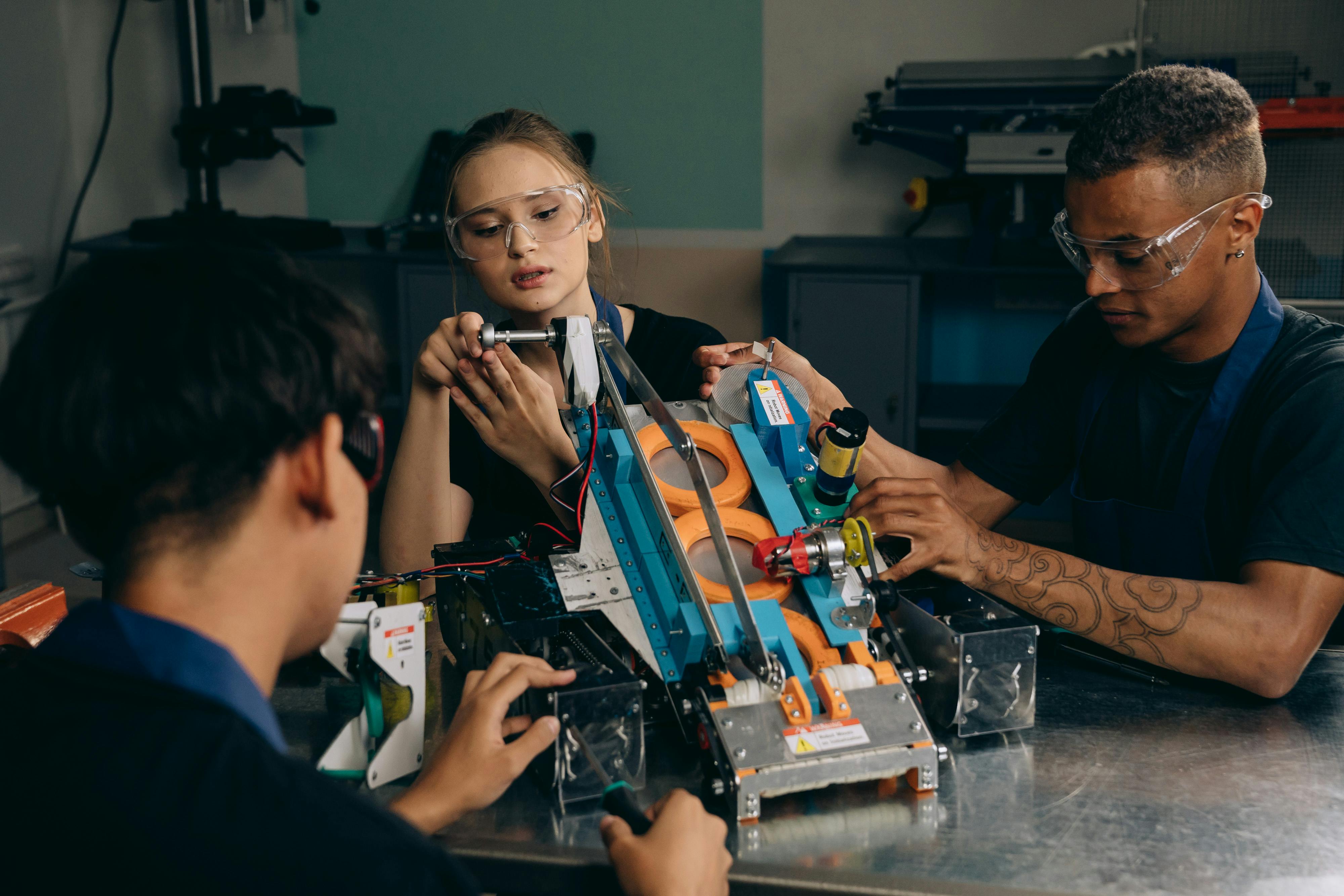 A Group of People Assembling a Robot