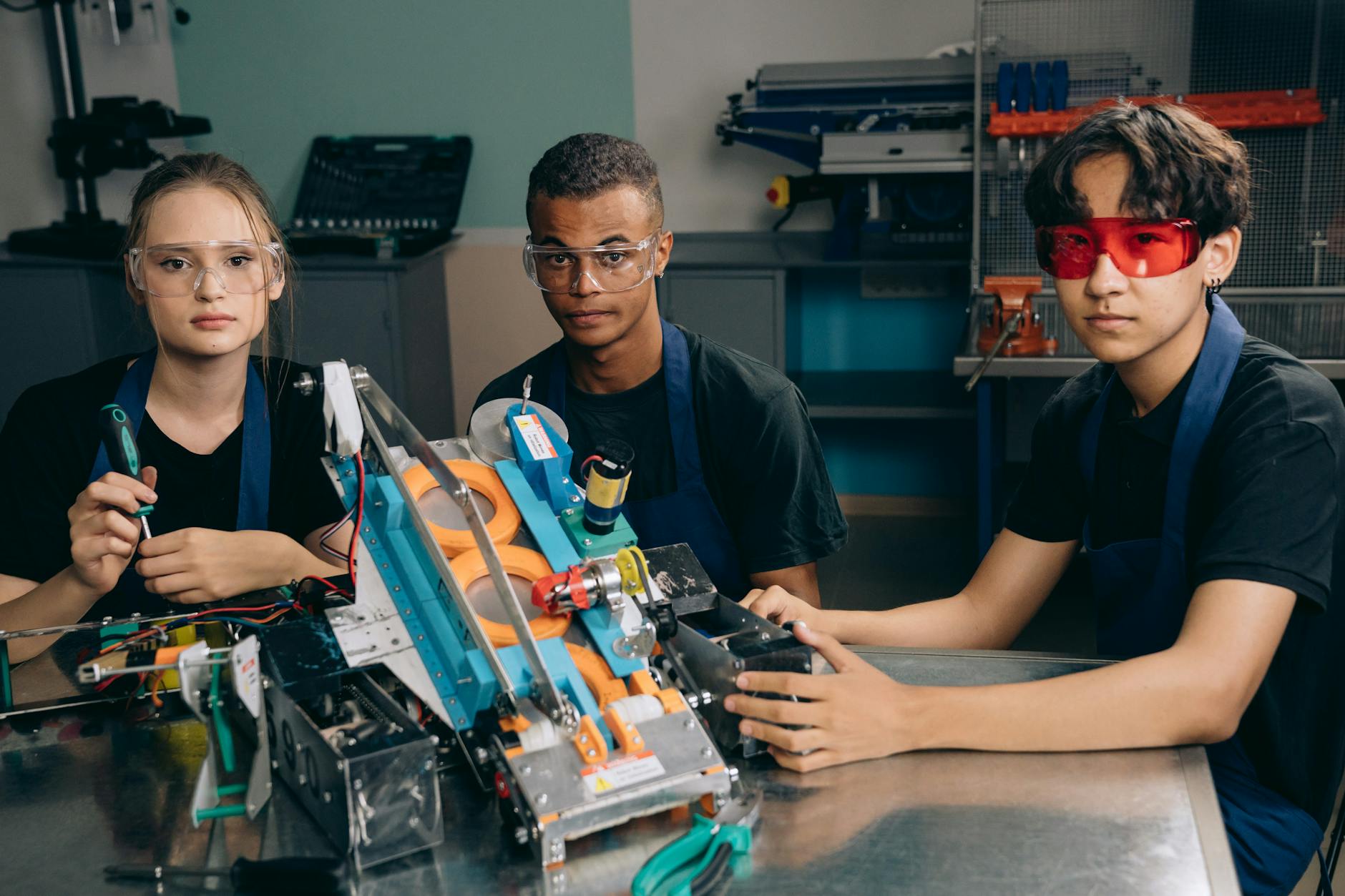 AI Content Generation Man in Black Shirt Wearing Red Protective Goggles Sitting beside Man in Black Shirt