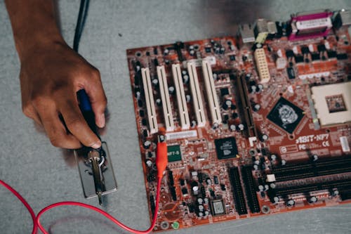 Person working on a Motherboard 