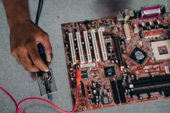 Computer hardware repair installation with soldering tools