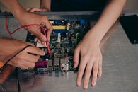A Person Holding a Motherboard