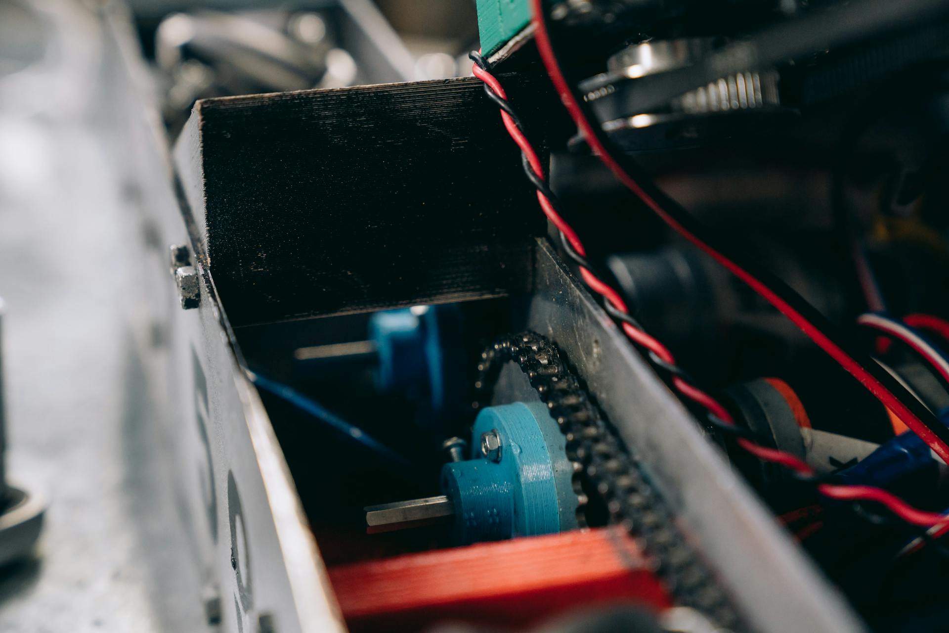 Detailed look at mechanical gears and components inside a machine for industrial use.