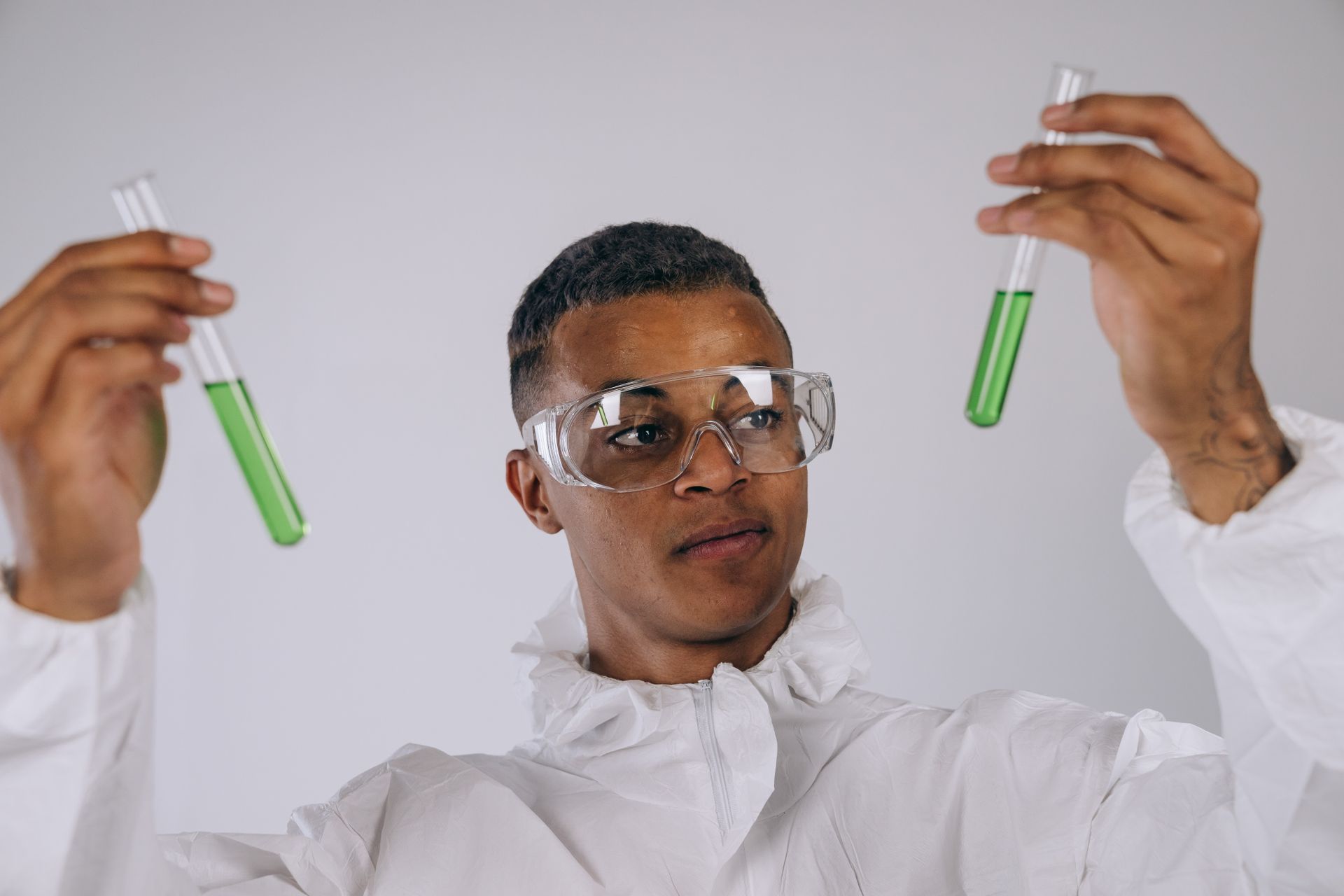 A Man Holding Test Tubes
