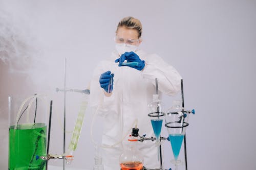 Scientist in Complete PPE doing an Experiment