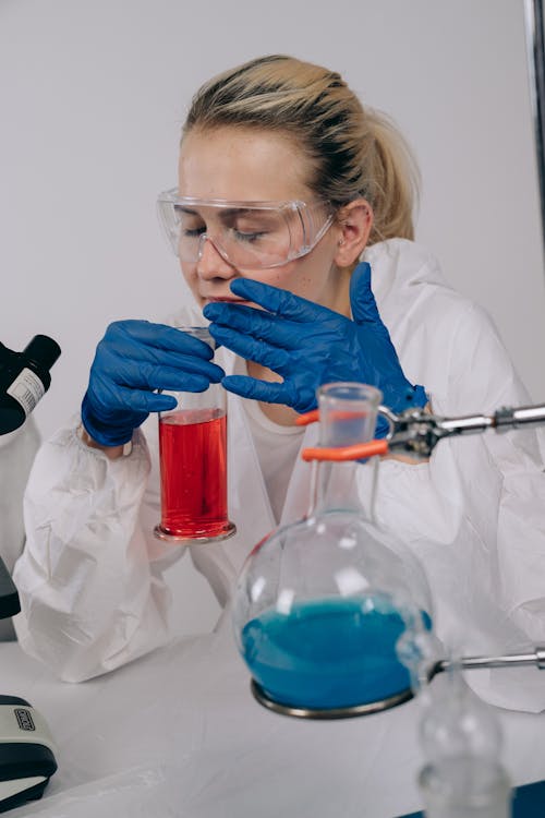 Scientist in PPE doing an Experiment