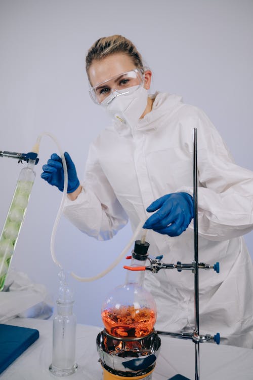 Scientist in PPE doing an Experiment

