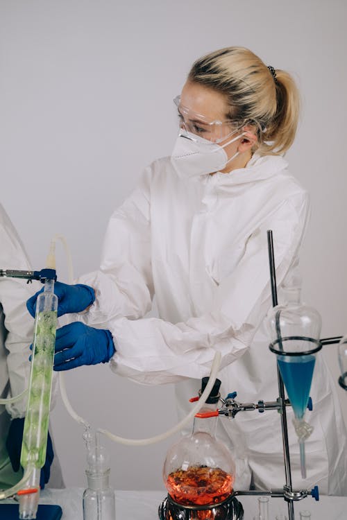 Scientist in PPE doing an Experiment