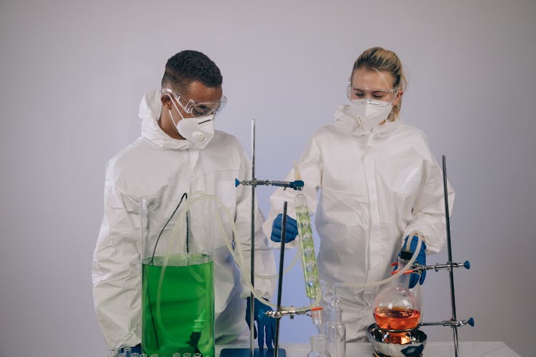 Man And Woman Experimenting Chemicals