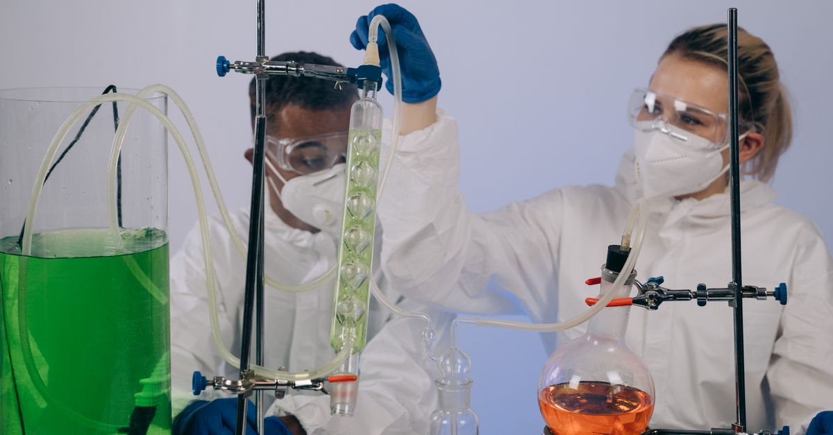 Researchers reviewing laboratory analysis in a high-tech chemistry lab