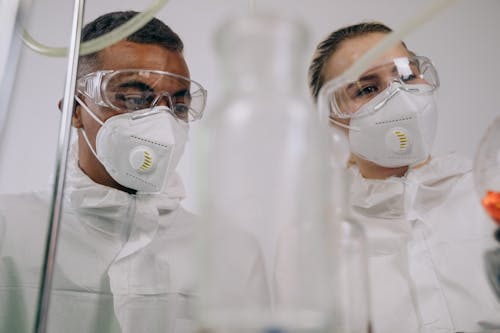 Chemists Wearing Face Mask and Safety Glasses