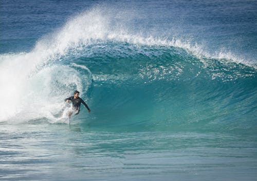 A Man Surfing on the Sea