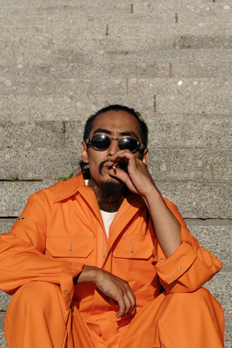 An Inmate Smoking A Cigarette