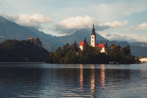 Free Idyllic landscape capturing Lake Bled with the Pilgrimage Church on Bled Island. Stock Photo