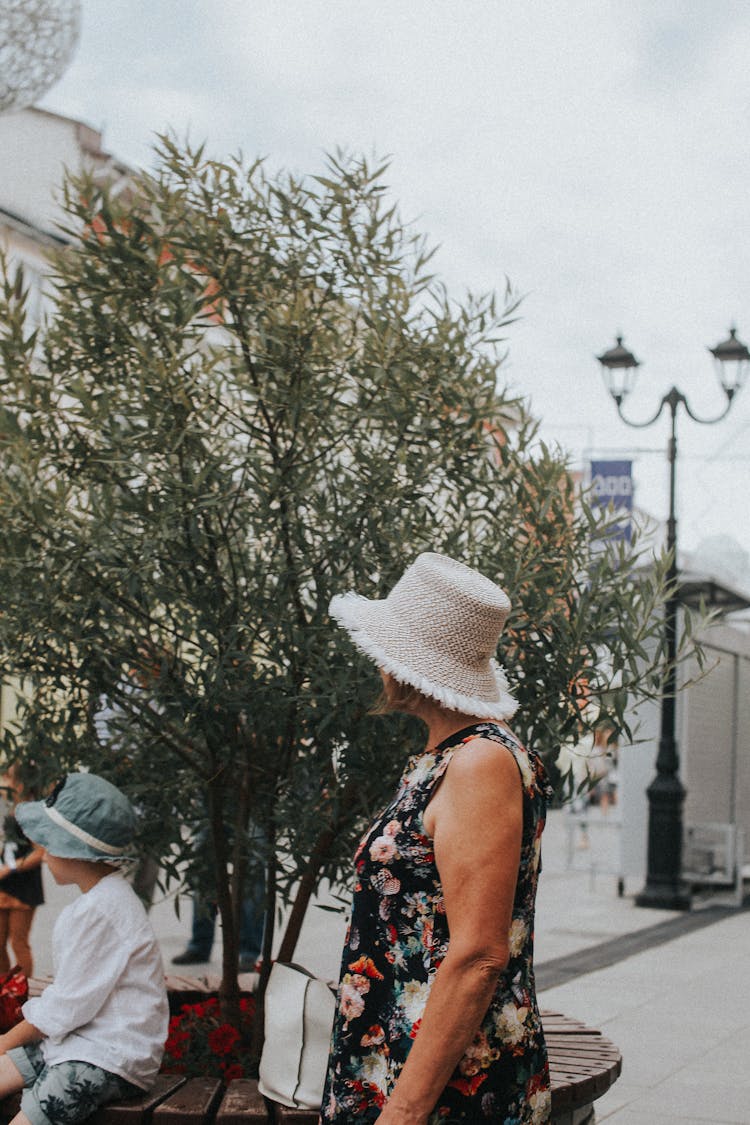 Woman In Straw Hat In City