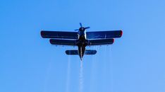 Black and Red Plane Flying in the Sky
