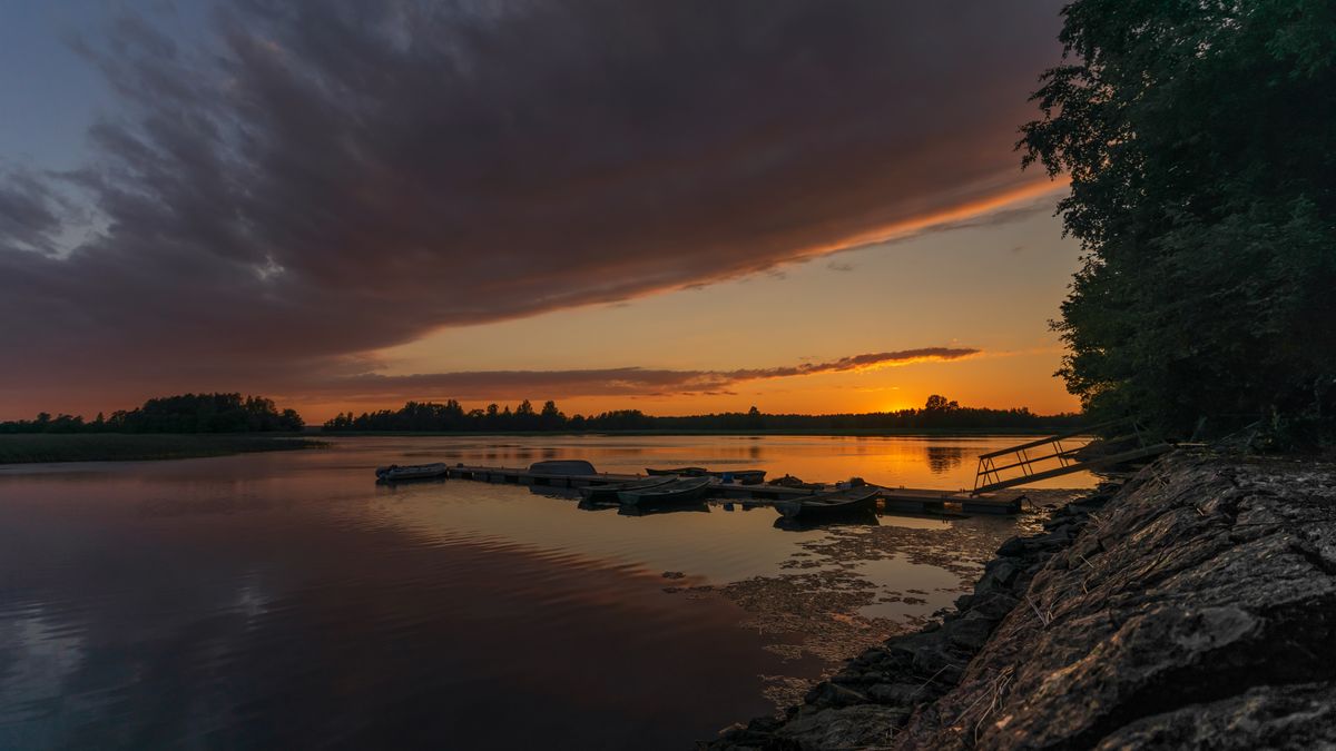 Photo: Alexey Turenkov / Pexels Wooden dock on a calm lake at sunset