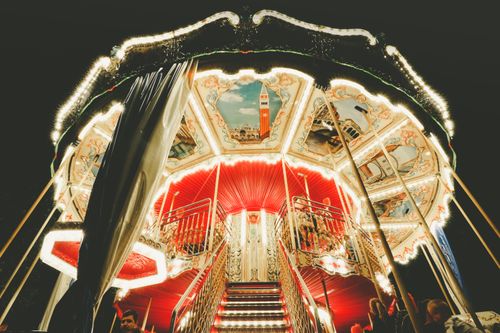 Free Brightly lit carousel at night, showcasing funfair vibrancy in Timișoara, Romania. Stock Photo